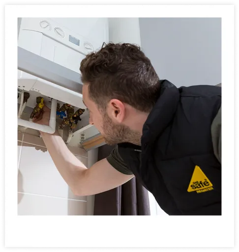 A photograph of a toilet and sink fitted by Design Heating
