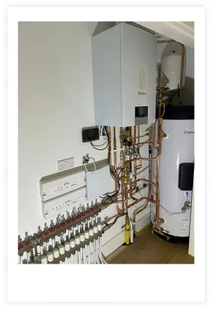 A photo showing the entire boiler and piping setup