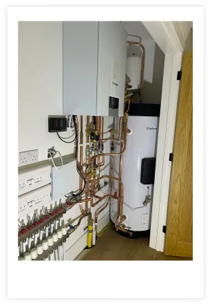 A photo of a boiler with copper pipework