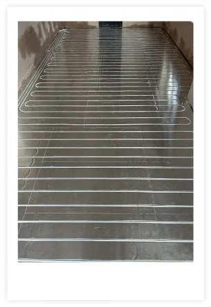 Photo showing Underfloor heating pipes being installed